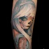 Illustrative style colored arm tattoo of interesting looking woman with tattoos