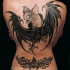 Illustrative style colored back tattoo of big funny bat