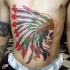 Illustrative style colored belly tattoo of Indian skull