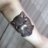 Illustrative style colored biceps tattoo of raccoon with mask