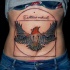 Illustrative style colored big belly tattoo of bird with various geometrical figures and lettering