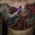Illustrative style colored chest tattoo of snake and mongoose fight