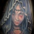 Illustrative style colored demonic woman in hood tattoo