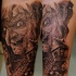 Illustrative style colored forearm tattoo of creepy witch with tree house