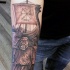 Illustrative style colored forearm tattoo of viking warrior with sailing ship