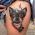 Illustrative style colored funny looking thigh tattoo of dog with Batman mask