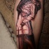 Illustrative style colored kissing couple tattoo on leg