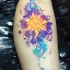 Illustrative style colored leg tattoo of Hinduism style sun