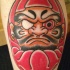 Illustrative style colored leg tattoo of pirate like daruma doll