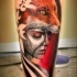 Illustrative style colored leg tattoo of woman with fox helmet
