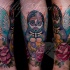 Illustrative style colored leg tattoo of Matryoshka with flowers