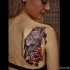 Illustrative style colored scapular tattoo of crow with key and rose