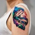 Illustrative style colored shoulder tattoo of mountains with flowers