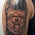 Illustrative style colored shoulder tattoo of wolf in dark forest with moon