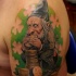 Illustrative style colored shoulder tattoo of Leprechaun with golden coins