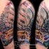 Illustrative style colored shoulder tattoo of sailing ship with mermaids