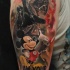 Illustrative style colored shoulder tattoo of Darth Vader with lettering and Mickey Mouse