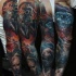 Illustrative style colored sleeve tattoo of big diamond with human in has mask and monsters