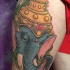 Illustrative style colored tattoo of saint elephant with helmet