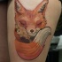 Illustrative style colored thigh tattoo of cute fox family