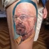 Illustrative style colored thigh tattoo of Breaking Bad main hero