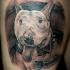 Illustrative style colored thigh tattoo of funny dog and lettering
