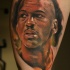 Illustrative style colored thigh tattoo of Jordan face