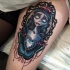 Illustrative style colored thigh tattoo of fantasy woman with diamond and butterfly