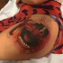 Illustrative style colored thigh tattoo of TV monster hero