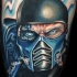 Illustrative style colored thigh tattoo of Mortal Combat hero