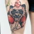 Illustrative style colored thigh tattoo of panda boxer with lettering