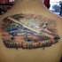 Illustrative style colored upper back tattoo of big plane with lettering