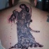 Illustrative style colored whole back tattoo of samurai woman with human head