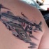 Illustrative style realistic looking scapular tattoo of WW2 fighter plane