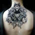 Illustrative style upper back tattoo of wolf with flowers