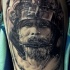 Impressive black and gray style big thigh tattoo of samurai warrior in helmet