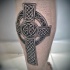Impressive Celtic cross gray ink tattoo on calf