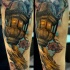 Impressive looking arm tattoo of vintage city lighter with tree branch