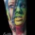 Impressive looking colored arm tattoo woman face with zipper