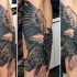 impressionante dipinto grande realistico dettagliato aquila tatuaggio su braccio