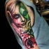 Incredible colored shoulder tattoo of creepy woman with flowers