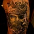 Incredible designed colored upper arm tattoo of creepy monster king
