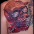 Incredible looking colored bloody back tattoo of human skull with glasses