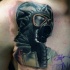 Incredible looking colored tattoo of human in radiation suit