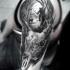 Incredible realism style large shoulder tattoo of deer skull combined with hunter