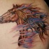 Indian horse tattoo on back
