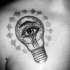 Interesting engraving style chest tattoo of bulb with human eye