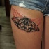 Interesting looking colored thigh tattoo of beautiful butterfly
