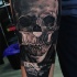 Interesting looking detailed forearm tattoo of cool looking skull