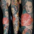 Tatuaggio colorato sul braccio geisha